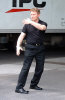 man-performing-exercises-in-street.jpg (29814 bytes)